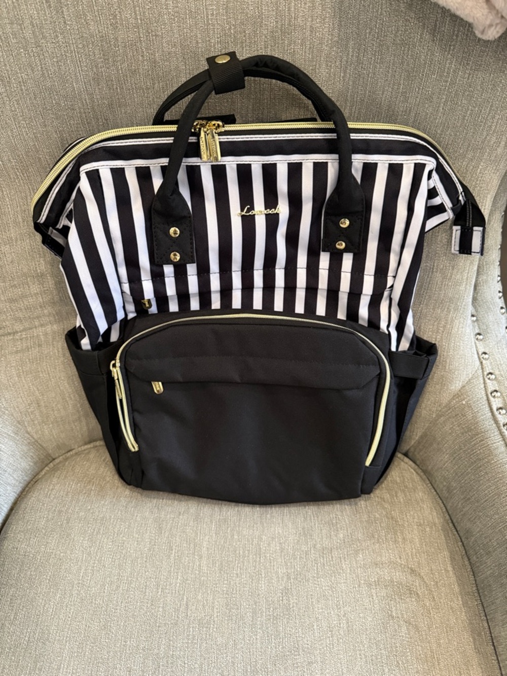 LOVEVOOK Black Striped Convertible Backpack Tote
NEW condition